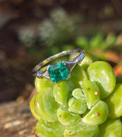 platinum emerald and diamond estate ring